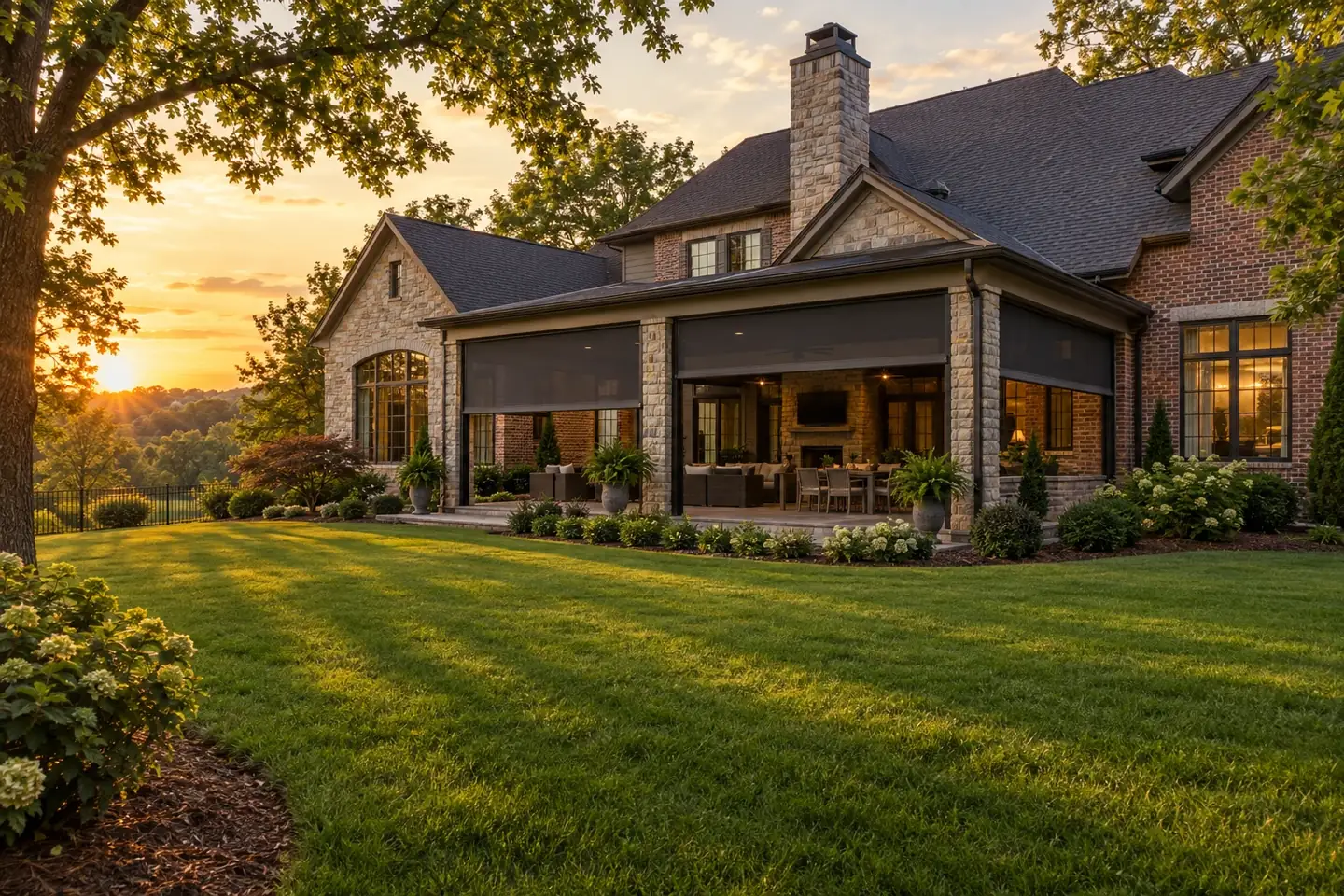 Brick and stone home with retractable screens on the covered patio